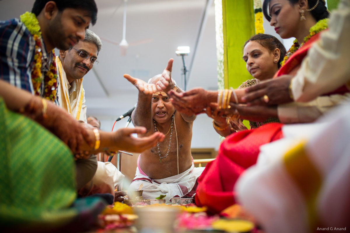 Iyer (Hindu Priest) chants mantra during brahmin wedding ceremony