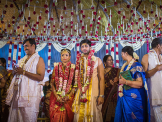 Tamil Brahmin Wedding Couples & their family members on beautifully decorated wedding hall in chennai