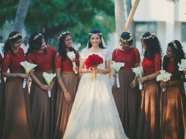 Beautiful Christian bride with her bridesmaids coming to enter church
