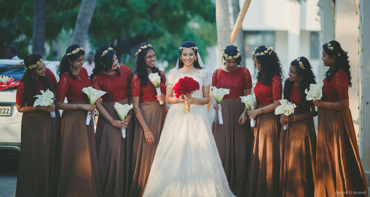 Beautiful Christian bride with her bridesmaids coming to enter church