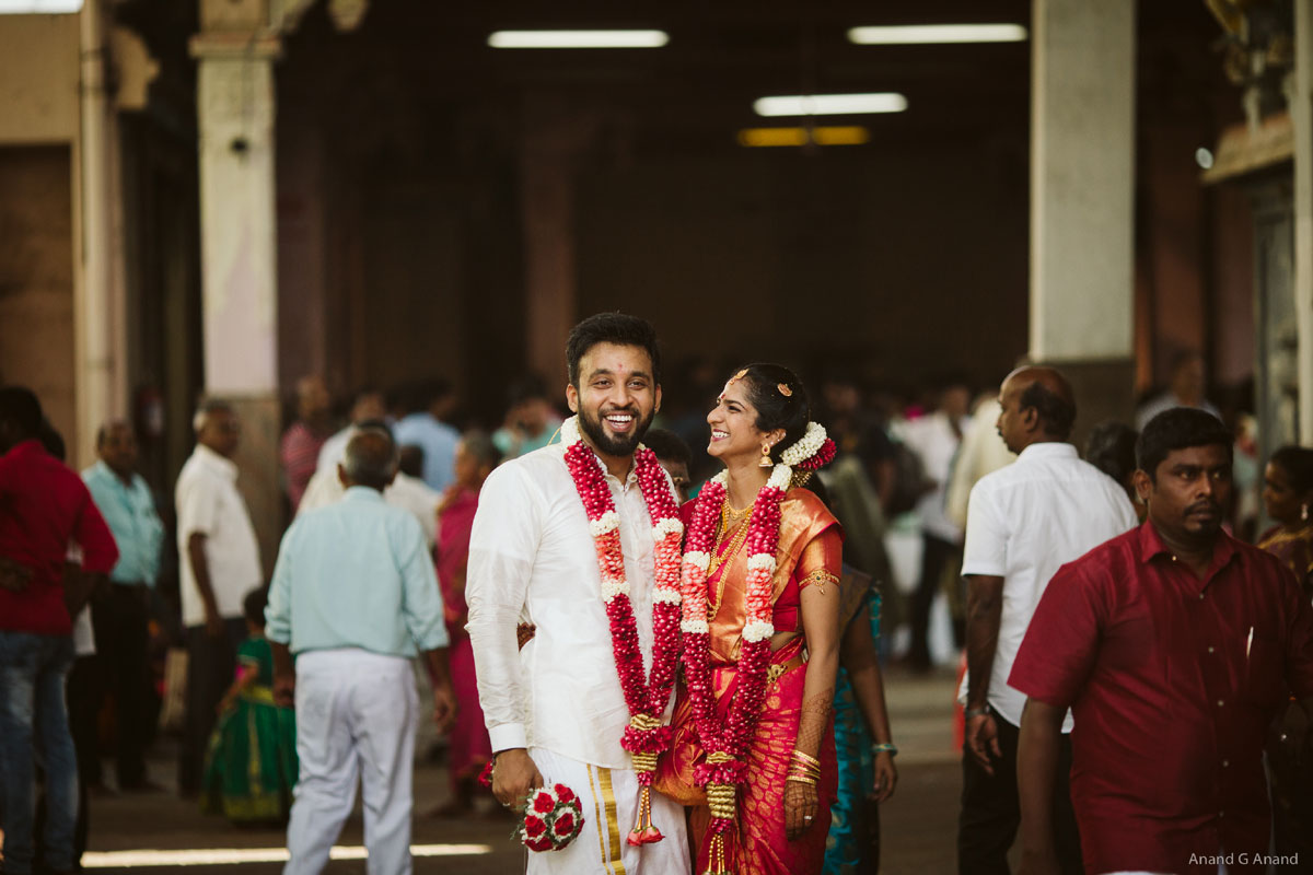 Beautiful wedding couple smiling shots at the temple background